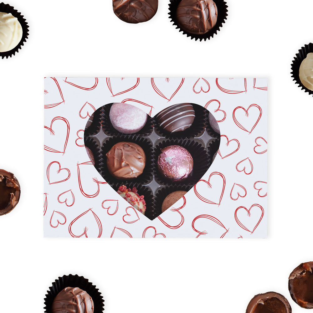 This premium gift box features a sophisticated love heart (Red &amp; White) pattern, complete with a heart-shaped cutout that offers a tantalising glimpse of the luxurious chocolate truffles nestled inside.  Each box contains a carefully curated collection of 12 milk, dark, and white chocolate truffles