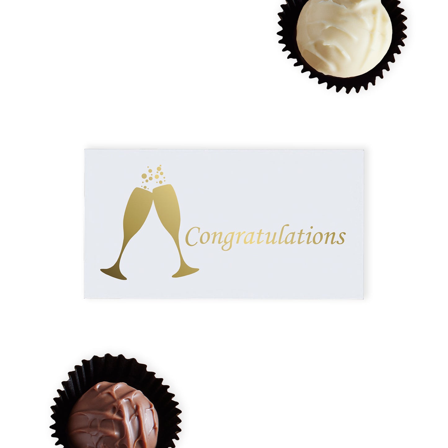 "Congratulations" Chocolate Gift Box, designed to mark every achievement with a touch of Luxury. This elegant white Luxury box features gold foil-printed champagne glasses and the word "Congratulations," making it a sophisticated choice for any congratulatory occasion. Inside, recipients will find two exquisite hand-finished truffles, one in rich milk chocolate and the other in creamy white chocolate