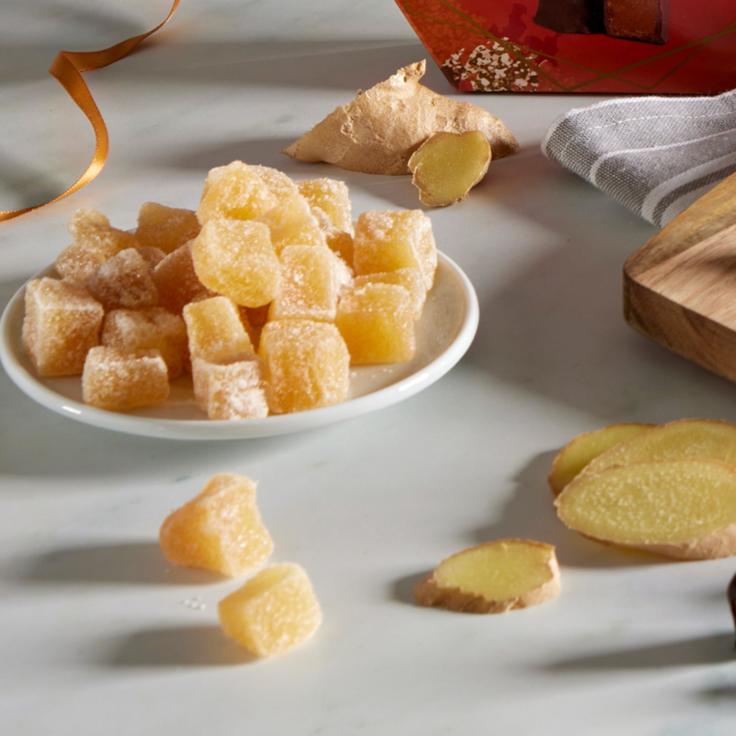 plate of crystallised ginger cube pieces sugar dusted