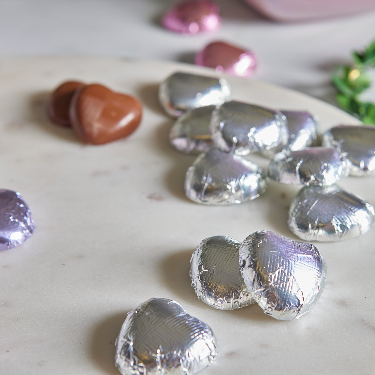 milk chocolate hearts individually wrapped in silver foil packed in 1kg boxes
