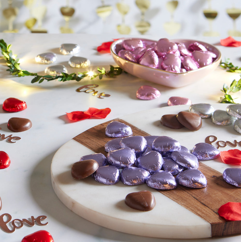 milk chocolate hearts individually wrapped in lilac foil packed in 1kg boxes