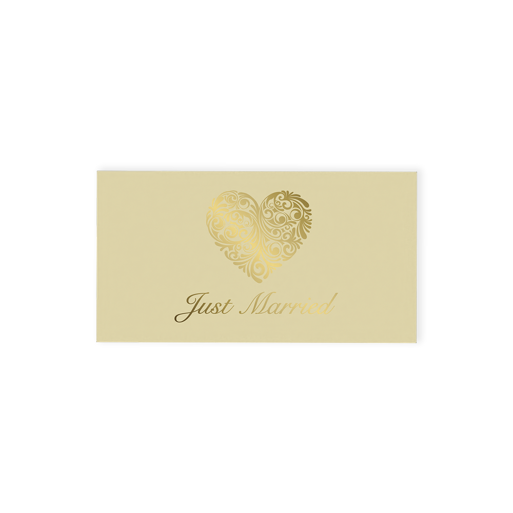 "Just Married" Chocolate Gift Box, an exquisite offering that pairs elegance with indulgence.  This cream-coloured gift box is beautifully adorned with an ornate gold heart and stylish "Just Married" font on the top, making it a standout addition to any wedding celebration.  Inside, discover two delicious hand-finished truffles, one milk and one white chocolate