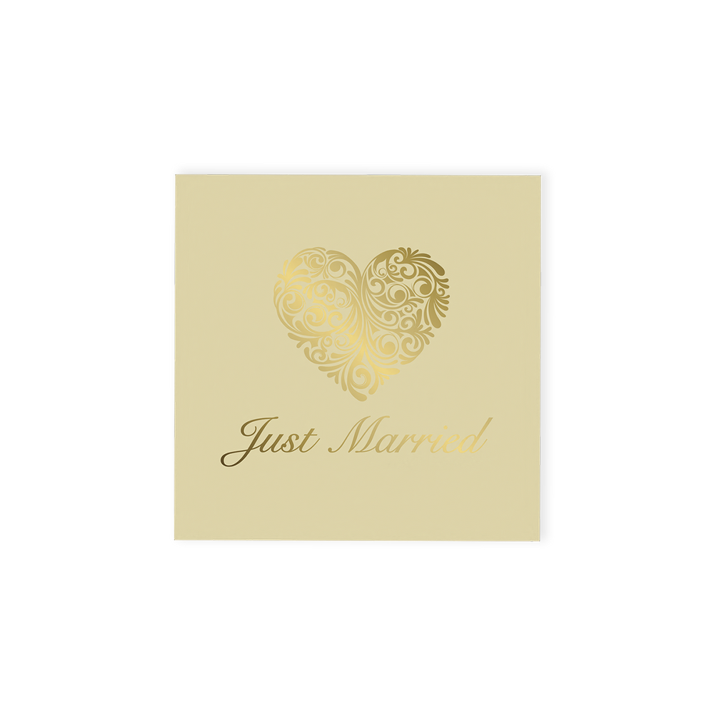 "Just Married" Chocolate Gift Box, an exquisite offering that pairs elegance with indulgence.  This cream-coloured gift box is beautifully adorned with an ornate gold heart and stylish "Just Married" font on the top, making it a standout addition to any wedding celebration.  Inside, discover four delicious hand-finished truffles, an assortment of milk, dark and white chocolates