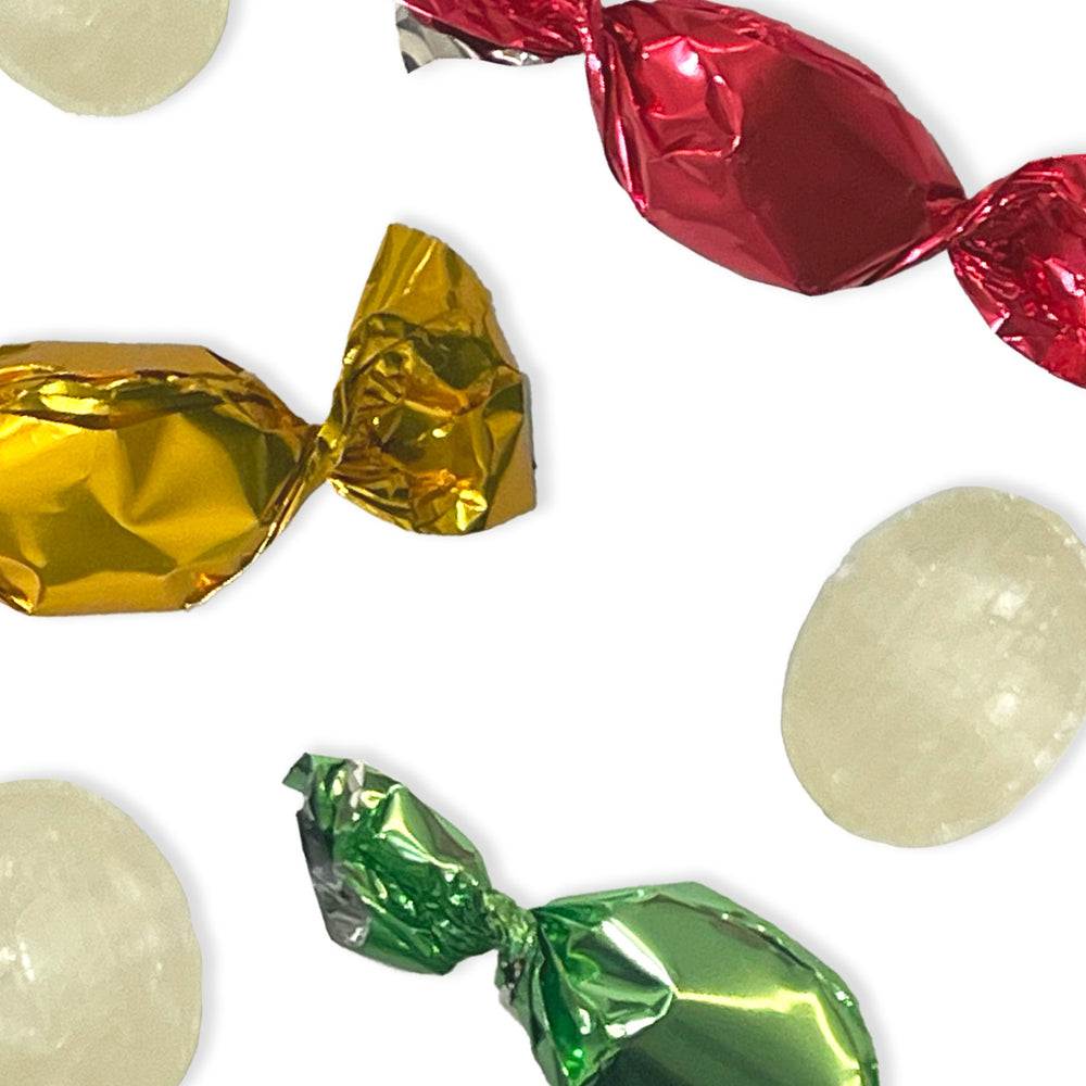 small, hard-boiled sweets, each bursting with the juicy essence of fruit flavours and individually wrapped in a rainbow of colourful wrapper