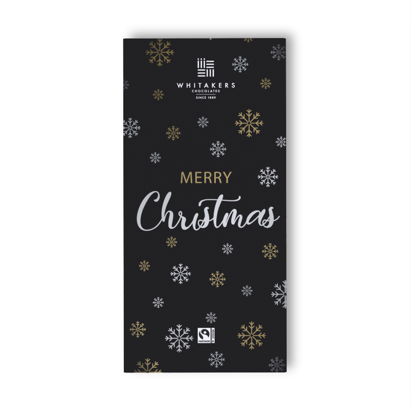 our 'Merry Christmas' Milk Chocolate Bar, a luxurious 90g indulgence wrapped in an elegantly festive design. The wrapper boasts a grown-up pattern of intricate snowflakes, rendered in a chic and refined colour palette of black, gold, and silver